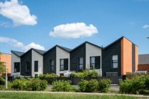 Modern residential houses under a clear blue sky in Hauts-de-France, France.